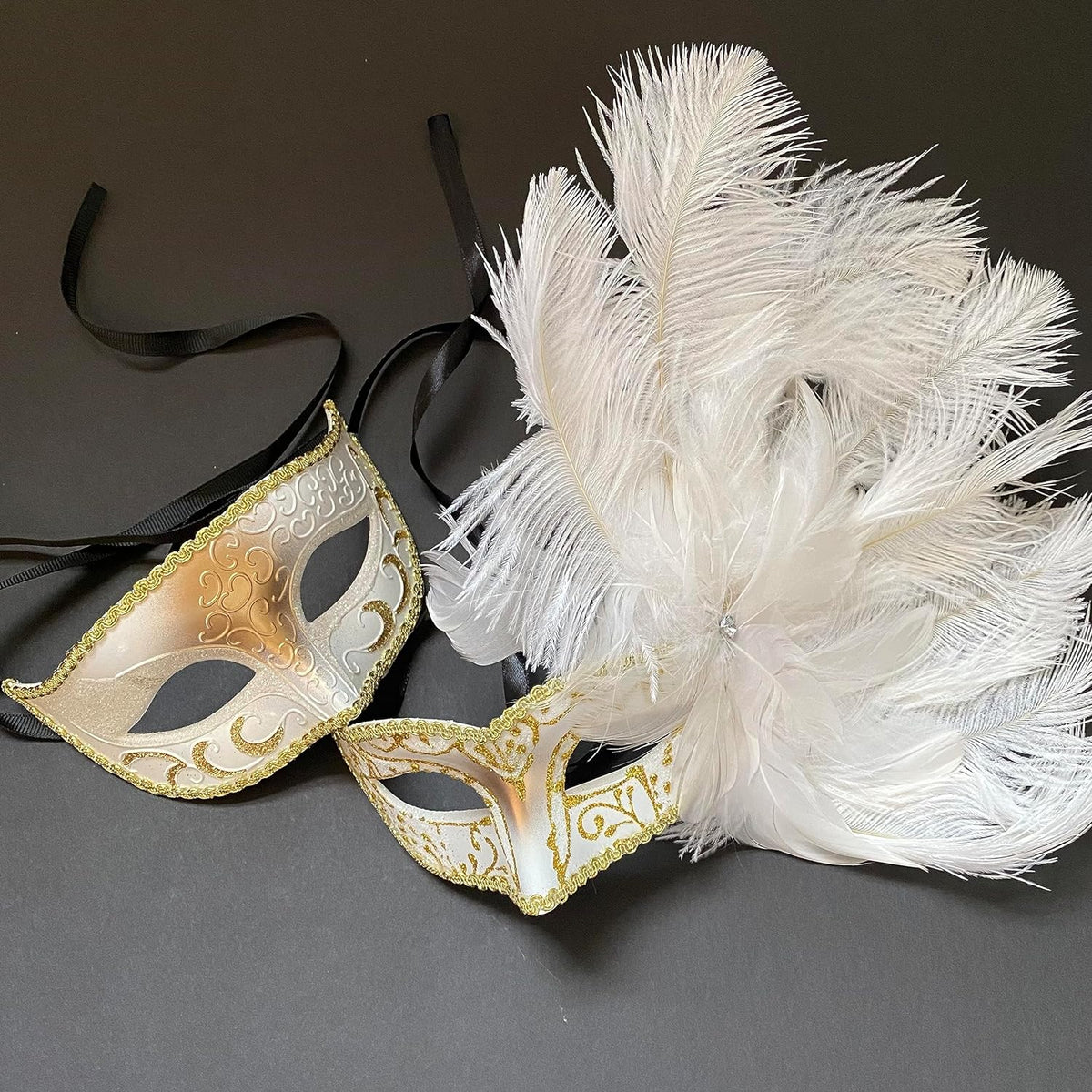 White and gold Mardi Gras masquerade mask pair with white feathers
